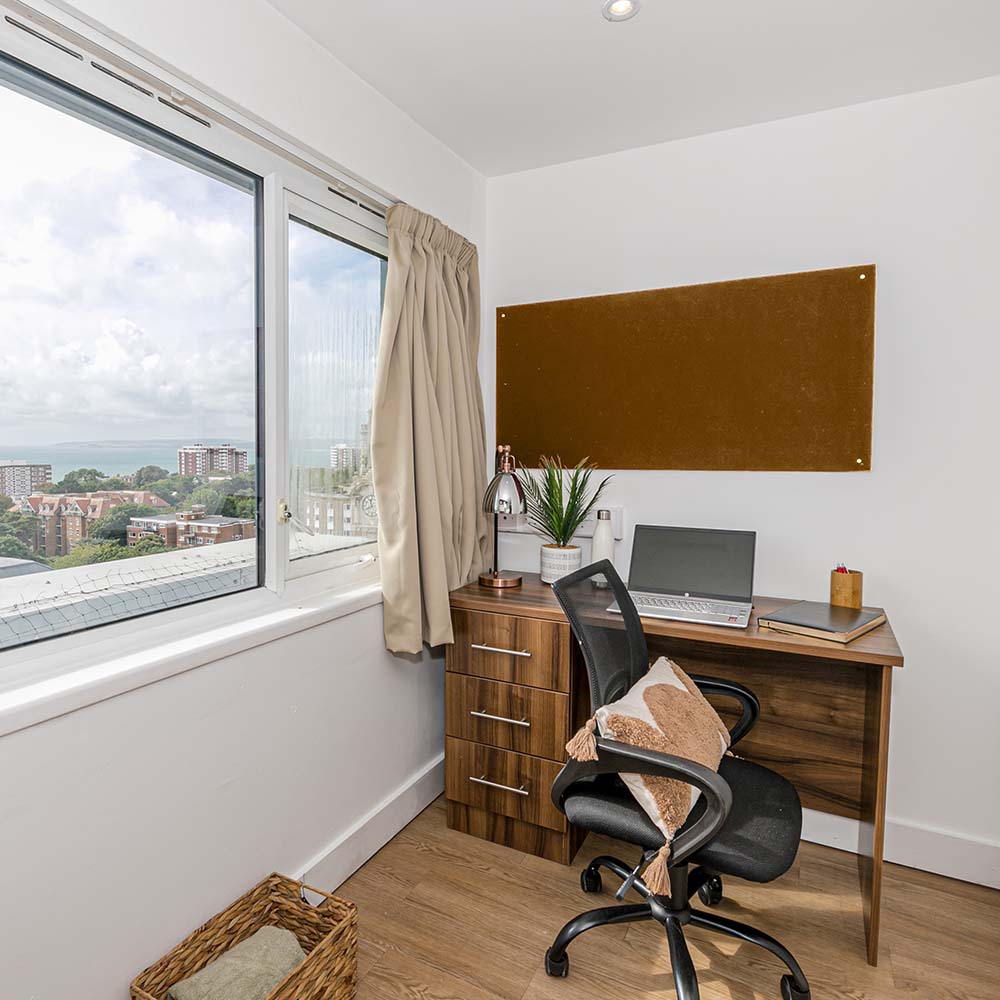 desk area with chair and laptop